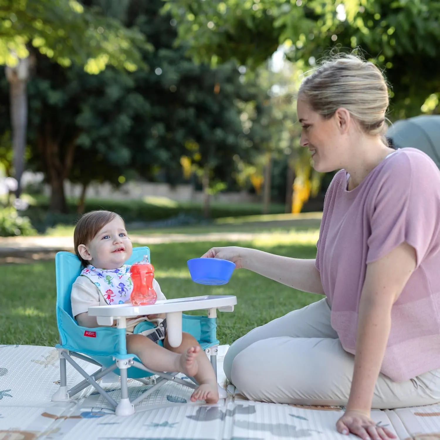 Nuby Easy Go Pop-Up Booster Seat with Removable Tray - 6  Months - Portable Booster Seat for Floor for Indoor/Outdoor Use - 3-Point Safety Adjustable Straps - Includes Travel Bag - Fun Faces
